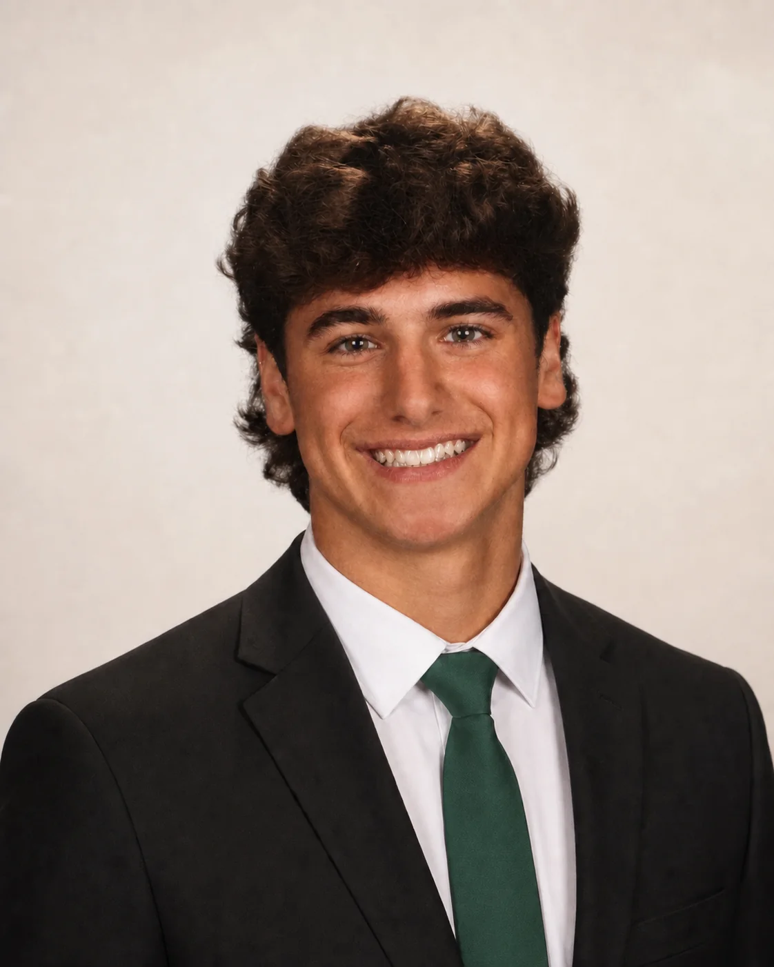 Brendan Rook, independent website designer, wearing a suit and light green tie